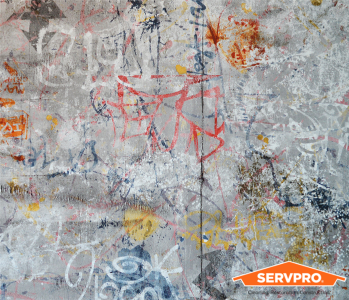 graffiti on wall SERVPRO logo